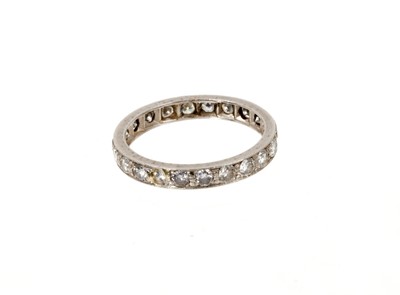 Lot 668 - Diamond eternity ring with a full band of twenty two brilliant cut diamonds