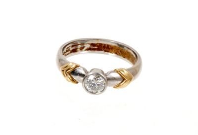 Lot 675 - Diamond single stone ring with a brilliant cut diamond in platinum rub over setting