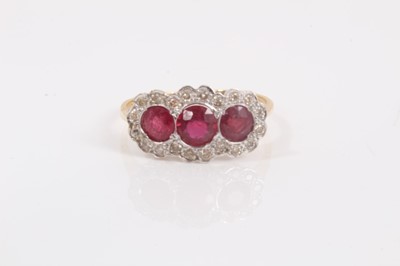 Lot 689 - Ruby and diamond triple cluster ring on 18ct yellow gold shank