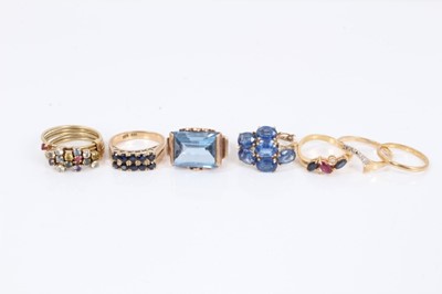 Lot 693 - Group of seven gold and gem-set dress rings to include a 1940s/1950s Odeonesque blue stone ring, 18ct ruby, sapphire and diamond ring, etc.