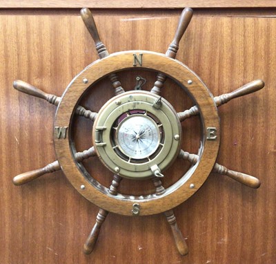 Lot 378 - Bass wall barometer mounted within a wooden ship's wheel