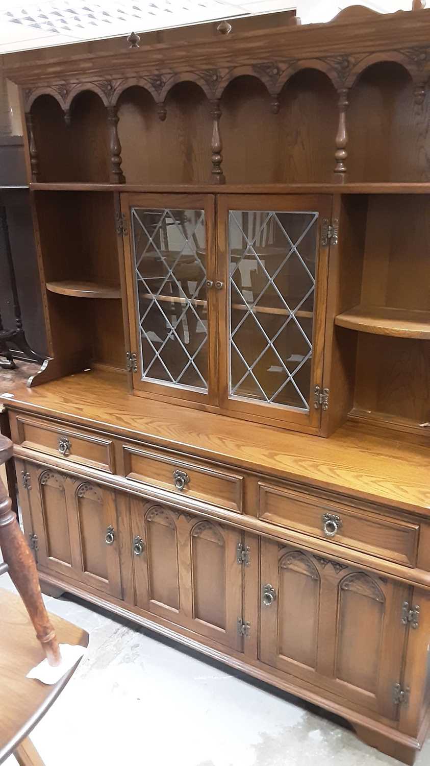 Lot 1316 - Old Charm oak two height dresser with open shelves and two central leaded glazed doors above, three drawers and three panelled doors below, 153cm wide, 44.5cm deep, 184cm high