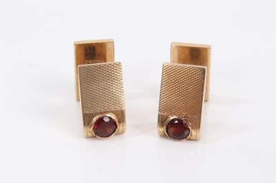 Lot 809 - Pair of Art Deco gold and garnet cufflinks