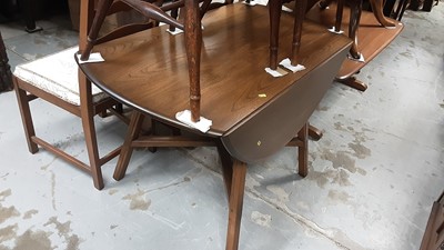 Lot 1340 - Ercol drop leaf table, set of four Ercol ladder back chairs, and a matching glazed bookcase