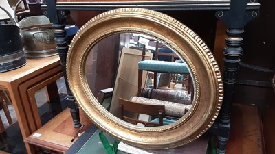 Lot 1363 - Pair of oval wall mirrors in gilt frames, 65cm x 55cm