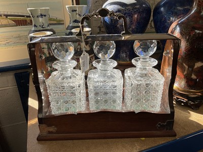 Lot 222 - Edwardian tantalus with three hobnail cut glass decanters in silver mounted oak case