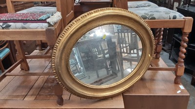 Lot 1371 - Pair of oval wall mirrors in gilt frames, 65cm x 55cm