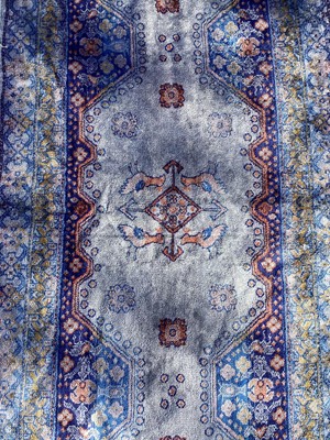 Lot 1374 - Part silk runner with bird and floral decoration on blue ground, 195cm x 58cm