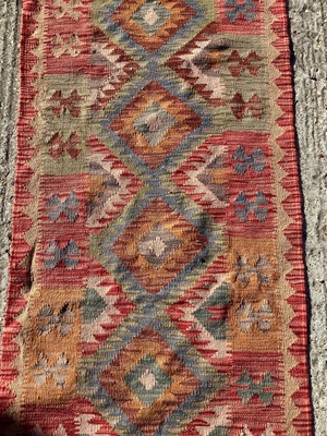 Lot 1377 - Kilim runner with geometric decoration, 207cm x 61cm