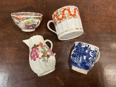 Lot 275 - Lowestoft polychrome cream jug, Worcester 'Dragons in Compartments' tea bowl, and two English coffee cups (4)