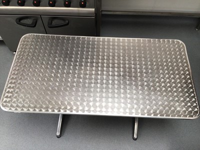 Lot 10 - A brushed stainless steel rectangular top table, with plated column pedestals, 1200 mm x 600 mm