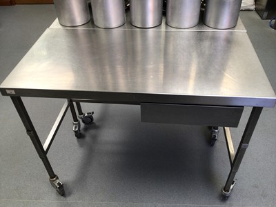 Lot 13 - A stainless steel freestanding preparation bench, with drawer,  on castors, 1200 mm