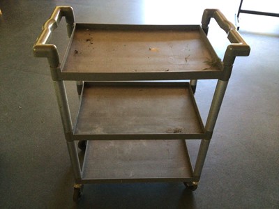 Lot 18 - A black plastic two tier tea trolley, on castors, 610 mm x 460 mm