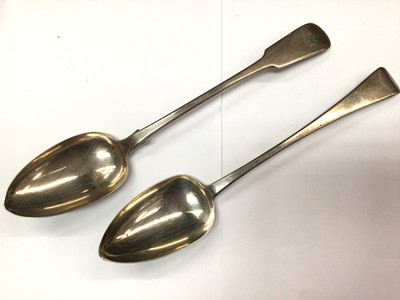 Lot 1068 - Two Georgian silver basting spoons