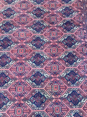 Lot 1398 - Large rug with geometric decoration on red and blue ground 303cm x 196.5cm