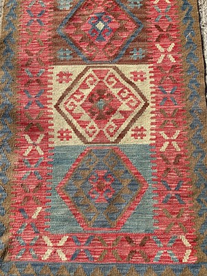 Lot 1409 - Eastern rug with geometric decoration and three central medallions, 129cm x 76cm, together with another rug, 132cm x 72cm (2)