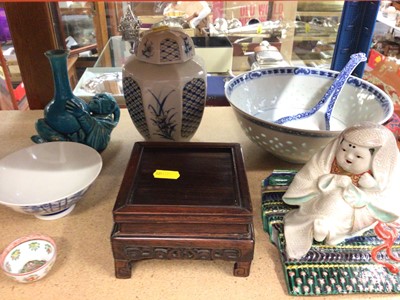 Lot 419 - Group of Oriental ceramics including bowls, vases, seated figure ornament and a hardwood stand