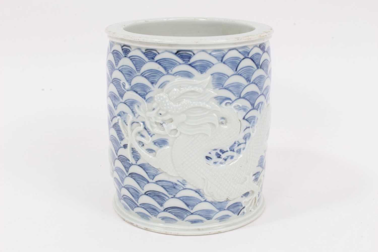 Lot 269 - A Chinese relief-decorated brush pot, in the style of Wang Bingrong