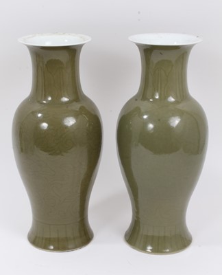 Lot 283 - A pair of Chinese dark celadon glazed vases