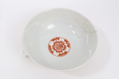 Lot 58 - A Chinese yellow ground sgraffito bowl and dish, decorated with roundels containing bats and shou characters in iron red enamel, marks to bases