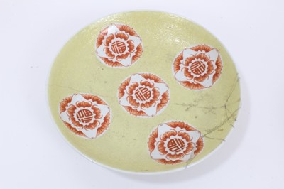 Lot 49 - A Chinese yellow ground sgraffito bowl and dish, decorated with roundels containing bats and shou characters in iron red enamel, marks to bases