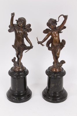 Lot 990 - A pair of well cast 19th century bronze figures of cherubs on marble bases