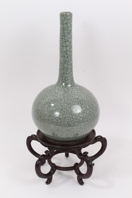 Lot 332 - An Oriental celadon crackle glazed bottle vase