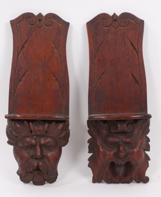 Lot 1027 - A pair of carved 19th century wall brackets with mask decoration