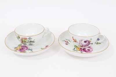 Lot 334 - Two Meissen polychrome painted cups and saucers