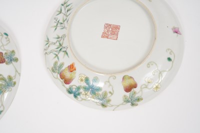 Lot 322 - A fine pair of Chinese porcelain dishes, of ogee form, polychrome decorated with fruit and insects, Daoguang marks, possibly of the period