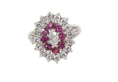 Lot 758 - Ruby and diamond cluster ring with a central marquise cut diamond surrounded by mixed cut rubies and brilliant cut diamonds in 18ct white gold setting