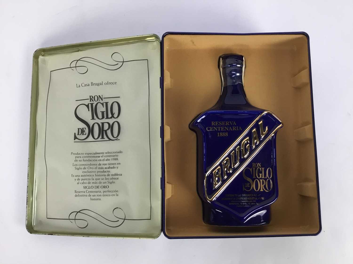 Lot 29 - One bottle, Ron Siglo De Soro, in ceramic bottle and original fitted tin box