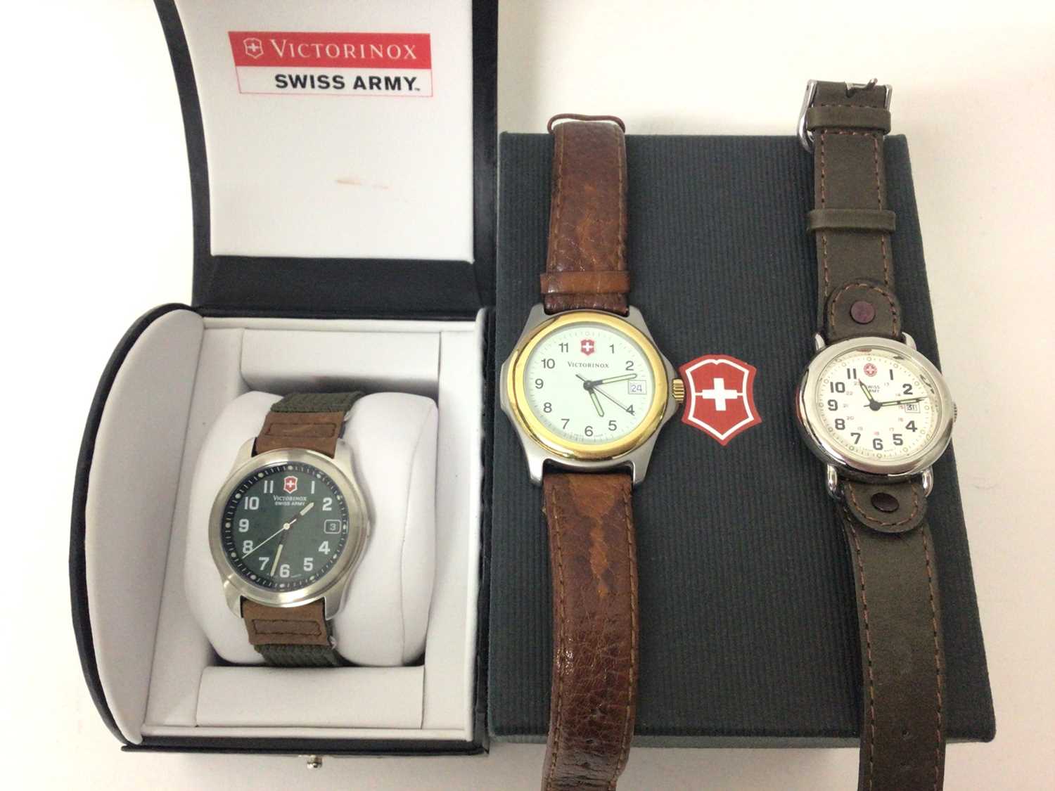 Lot 192 - Victorinox Swiss Army wristwatch in case, one other Victorinox watch and a Swiss Army watch (3)