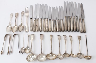 Lot 436 - Large selection of Georgian and later silver flatware, including condiment spoons, ladles, sifter spoons, sugar tongs, caddy spoon and other items, together with nineteen silver handled knives of v...