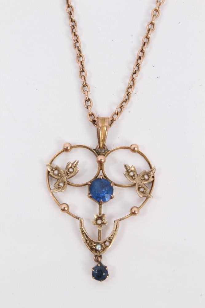 Lot 204 - Edwardian 9ct gold blue stone and seed pearl open work pendant on chain
