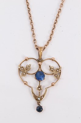 Lot 204 - Edwardian 9ct gold blue stone and seed pearl open work pendant on chain