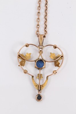 Lot 204 - Edwardian 9ct gold blue stone and seed pearl open work pendant on chain