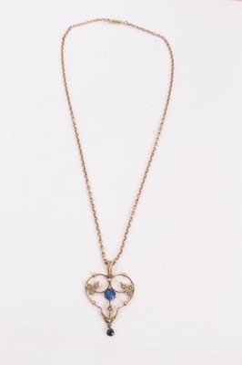Lot 204 - Edwardian 9ct gold blue stone and seed pearl open work pendant on chain