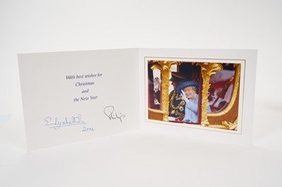 Lot 30 - H.M.Queen Elizabeth II and H.R.H. The Duke of Edinburgh, signed 2002 Christmas card with twin gilt ciphers to cover, splendid colour photograph of the Royal couple waving in the State Coach, signed...