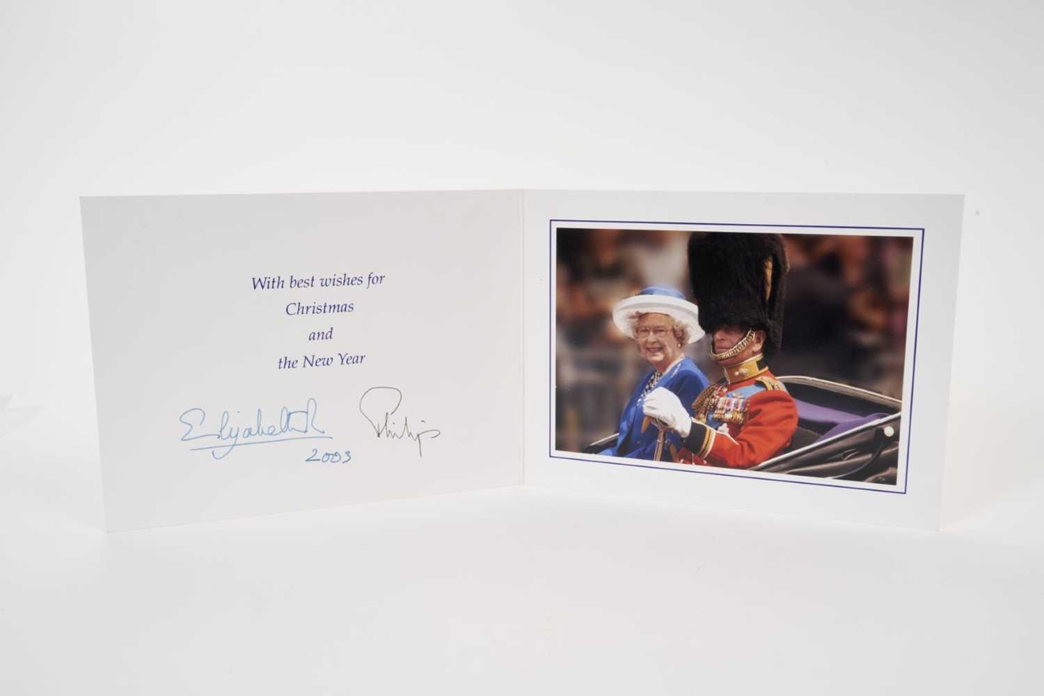 Lot 31 - H.M.Queen Elizabeth II and H.R.H. The Duke of Edinburgh, signed 2003 Christmas card with twin gilt ciphers to cover, splendid colour photograph of the Royal couple seated in an open landau, signed...