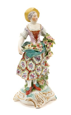Lot 257 - Derby figure of a young girl, with flowers in her apron, circa 1770