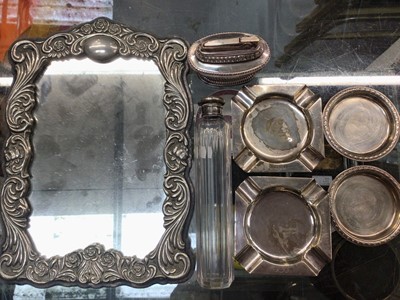 Lot 1101 - Pair silver ashtrays, pair silver pin dishes, silver topped glass bottle, Ronson table lighter and plated mirror