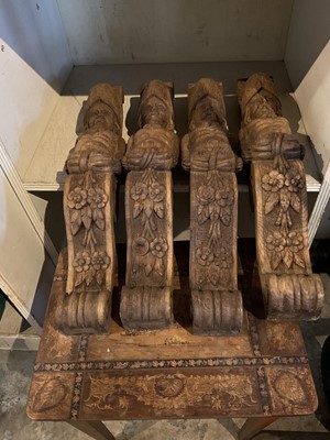 Lot 257 - Four antique carved oak brackets/spandrels with figure heads and carved foliate scrolls, together with an Italian musical table