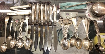 Lot 1109 - Group of silver and white metal teaspoons, six silver handled knives, two fruit knives, silver topped glass jar and silver swizzle stick