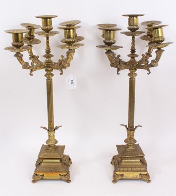 Lot 904 - Pair of classical revival brass candelabrum