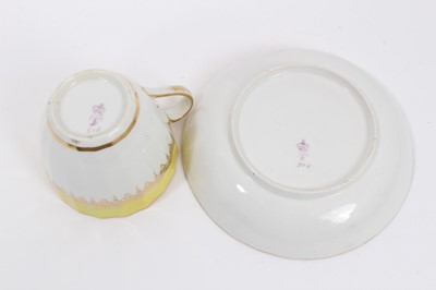 Lot 123 - A Derby faceted tea cup and saucer, with yellow ad gilt borders, circa 1790