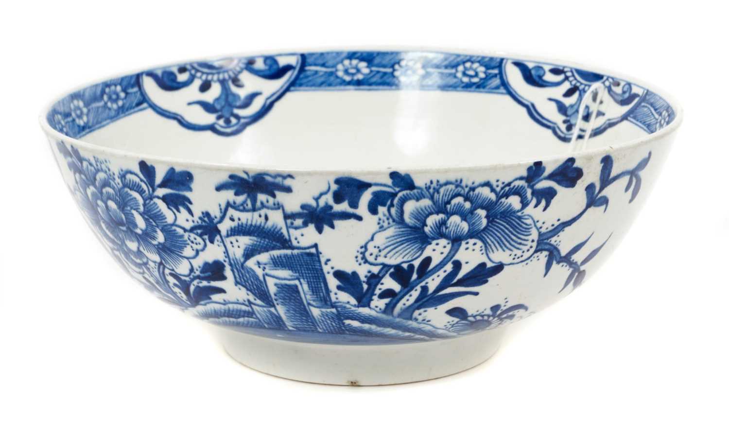 Lot 281 - An English porcelain round bowl, painted in blue, circa 1770, probably Bow