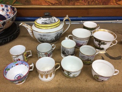 Lot 96 - A New Hall tea cup, with ring handle, a 19th century small mug with a view of Tunbridge Wells, and other cups and cans and a teapot and cover