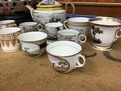 Lot 96 - A New Hall tea cup, with ring handle, a 19th century small mug with a view of Tunbridge Wells, and other cups and cans and a teapot and cover