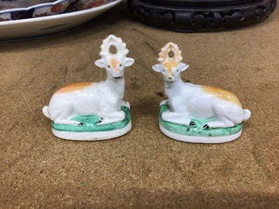 Lot 94 - A pair of Continental porcelain models of stags